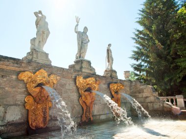 Sculptures on the cascade Gold Mountain in Peterhof. St. Petersb clipart