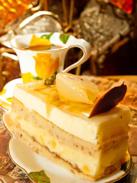 Sponge pear cake with soft praline in cafe — Stock Photo, Image