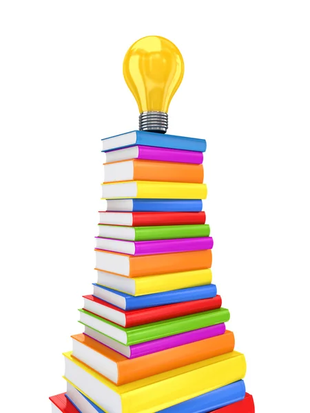 Žlutá lampa na velkou hromadu barevných knih. — Stock fotografie