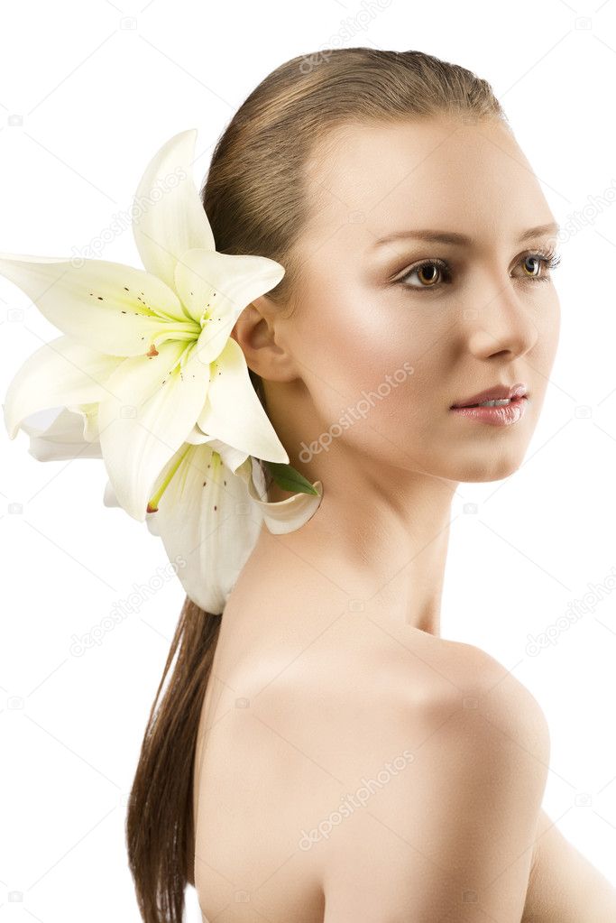 Beauty portrait with flowers the girl is turned of three quarter