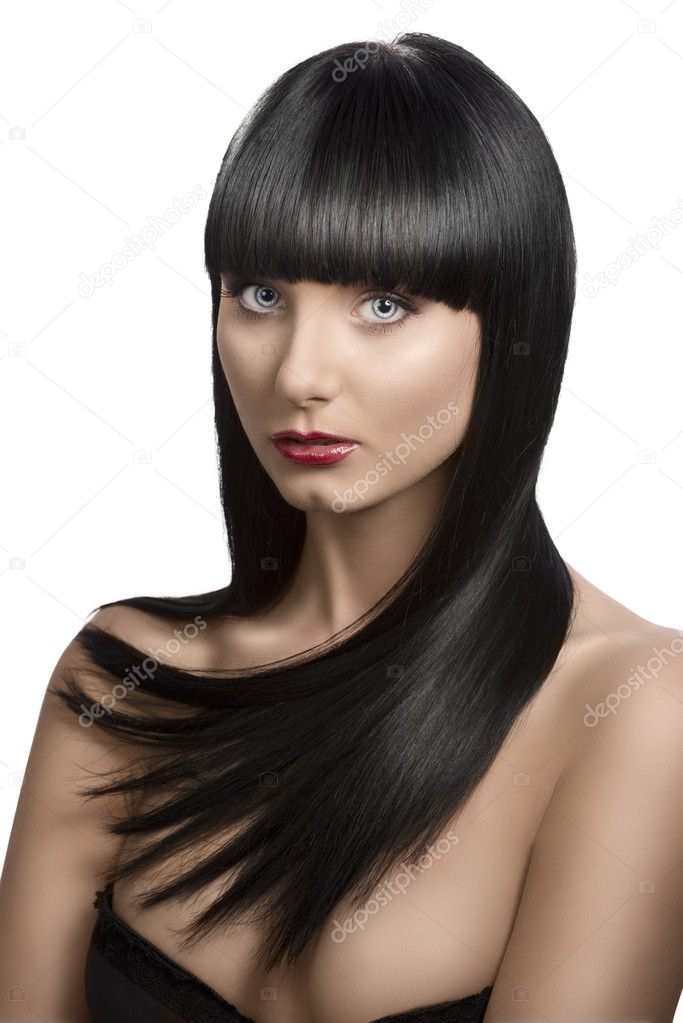 Girl's portrait with long dark hair, slightly turned of three qu