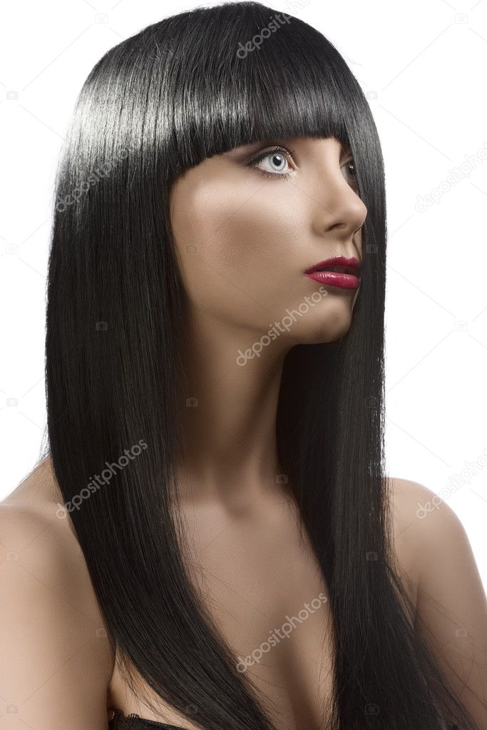 Girl's portrait with long dark hair with half face under the hai