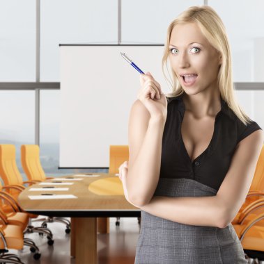 Blonde business woman tkes pen clipart