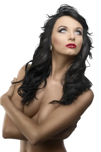 Menina bonita com cabelo ondulado longo olha para cima — Fotografia de Stock