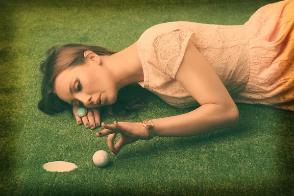 Holga camera effect of an elegant golf girl — Stock Photo, Image