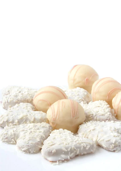 Candies and cookies in white chocolate — Stock Photo, Image