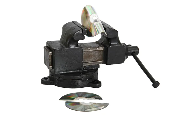 CD disk ve svěráku — Stock fotografie