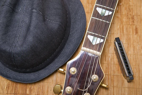 stock image Harmonic, hat and guitar on the wood background