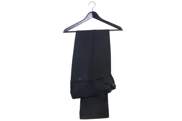 Stylish men's black pants on a hanger isolated on white background — Stock Fotó