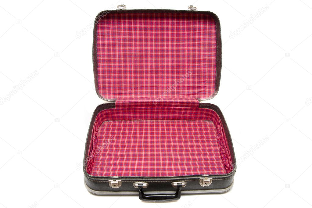 Open vintage suitcase over a white background