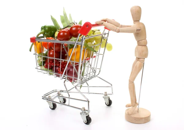 Frutas y verduras en un carrito de la compra — Foto de Stock