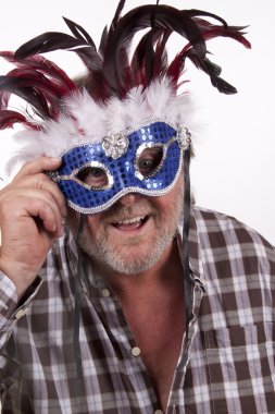 Eldery man is wearing a Venetian mask clipart