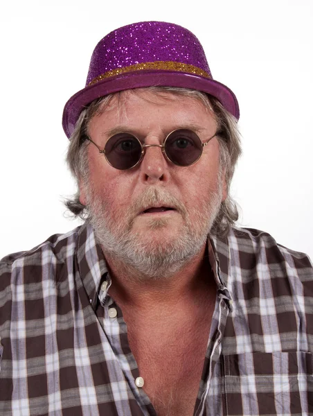Eldery man is wearing a funny hat and glasses — Stock Photo, Image