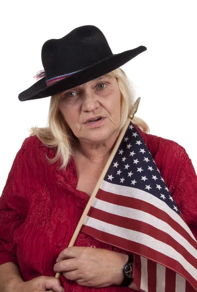 Elderly blond woman with a indian hat — Stock Photo, Image