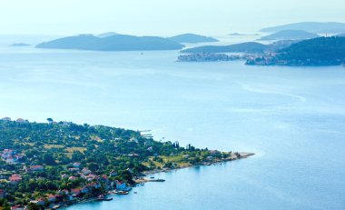 Morning summer coastline and village on seashore (Peljesac pe clipart