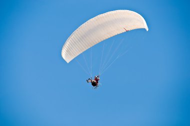 Parasailing in summer . clipart