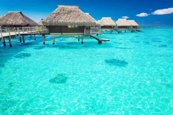 Water villas in the ocean with steps into lagoon — Stock Photo, Image