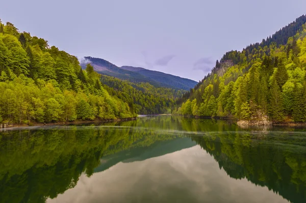 stock image Landscape with a mountain lake in spring