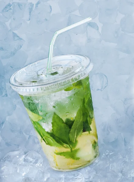 Cocktail mojito in plastic glass with ice — Stock Photo, Image