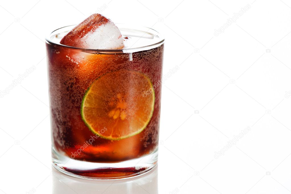 Glass of cola with ice and lemon. Isolated on white background