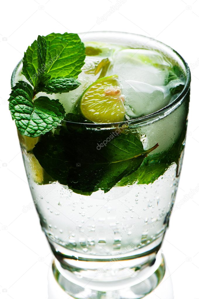 Closeup of lemonade with limes and mint on White background