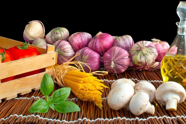 stock image Preparation of spaghetti pasta with tomatoes, garlic and olive oil