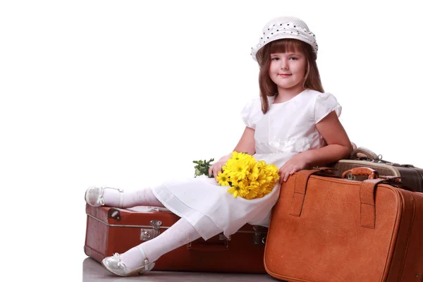 Criança encantadora em uma mala — Fotografia de Stock