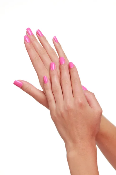 Donna mano con bella manicure rosa su sfondo bianco — Foto Stock