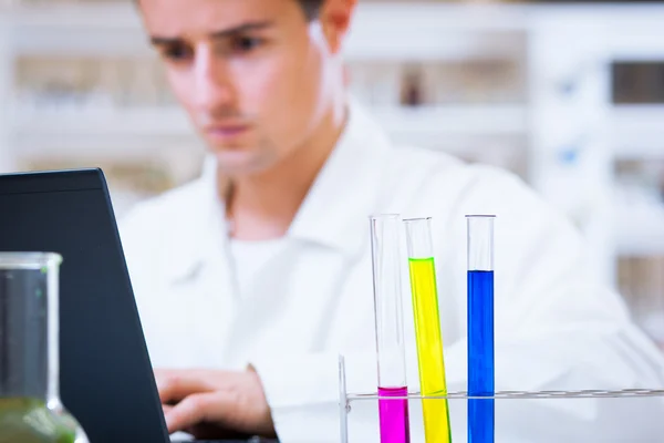 Close-up portrait of a young male researcher in a lab — Stock Photo, Image