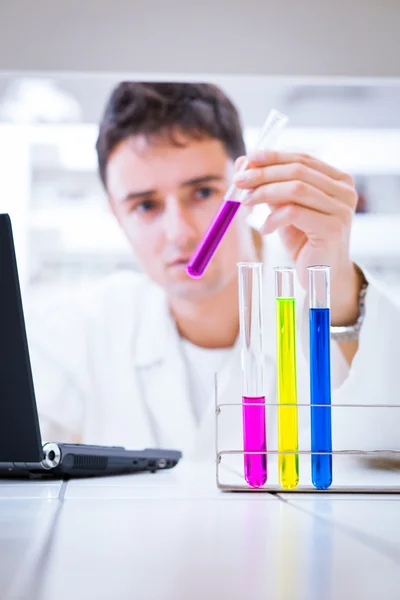 Close-up portrait of a young male researcher in a lab — Stock Photo, Image