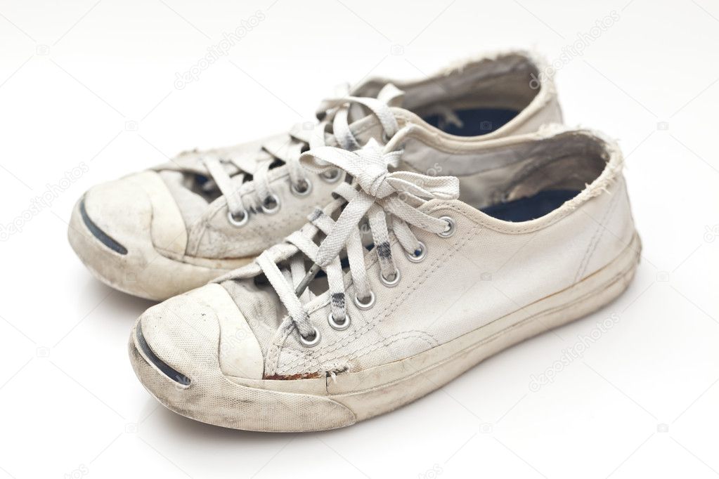 Old sport shoes on white background