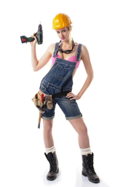 Sexy craftswoman in overalls — Stock Photo, Image