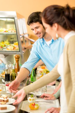 Dessert selection at cafeteria self-service buffet clipart