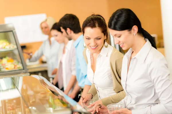 Cafeteria lunch two office woman choose food — Stock Photo, Image