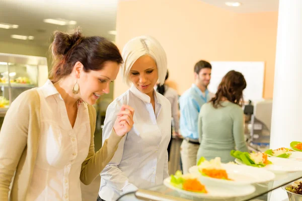 Young business colleagues select canteen lunch — Stock Photo, Image