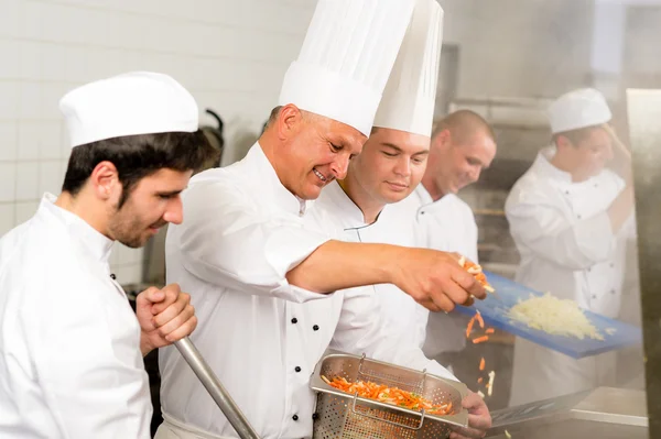 Two professional chefs cooking in kitchen — Stock Photo, Image