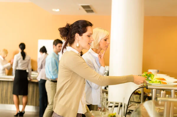 Young business colleagues select canteen lunch — Stock Photo, Image