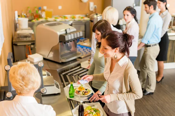 At the cafeteria woman pay bill — Stock Photo, Image