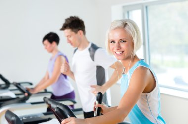 Fitness young on treadmill running exercise clipart