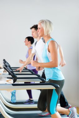 Running on treadmill young fitness center clipart