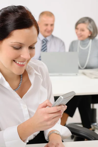 Young executive woman use phone during meeting — Stock Photo, Image
