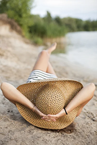 Image of relaxing female in big hat — Stock Photo, Image