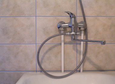 Crome shower faucet turned to right side clipart