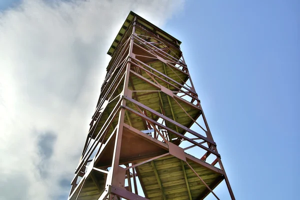 Rusty tower rising over ground under sky — Stock Photo, Image