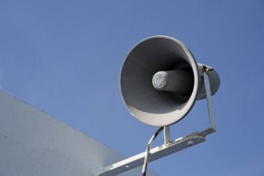 Isolated megaphone making loud noise at day clipart