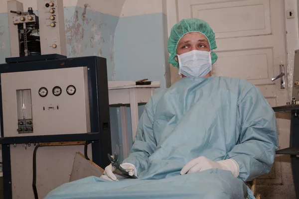 Surgeon take strange tool before coming surgery — Stock Photo, Image
