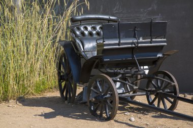 Black wagon without horses is abandoned clipart