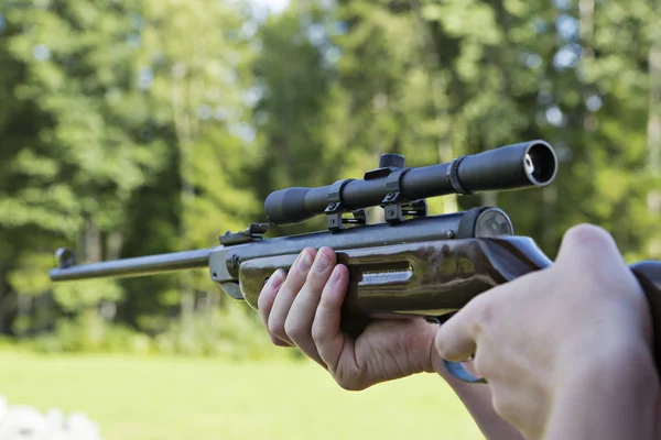 Fast targeting with hand weapon through sight — Stock Photo, Image