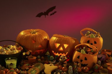 Halloween party decorations with carved pumpkins clipart