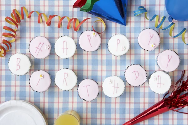 Cupcakes spell out happy birthday — Stock Photo, Image